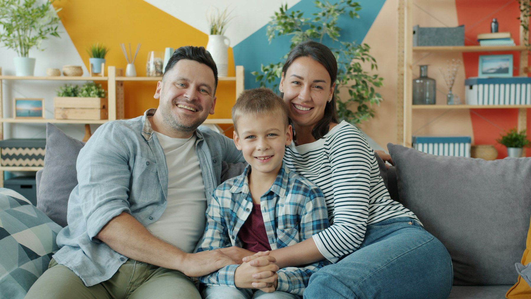 A smiling family relaxing together at home